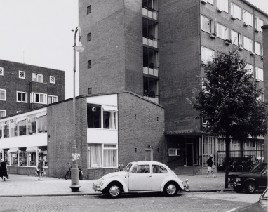 Front of the building in the 1960s, with a vintage car in front of it